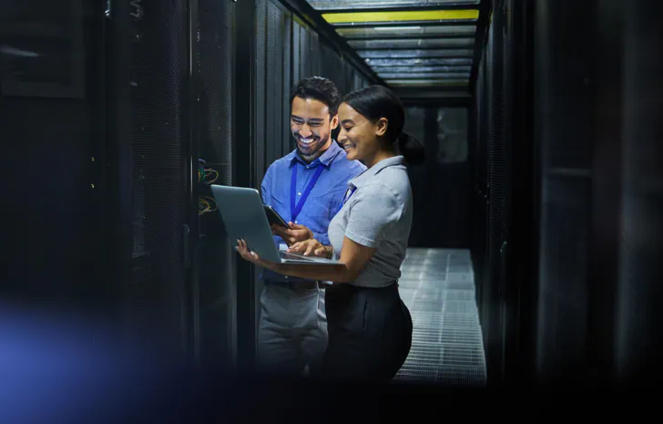 IT professionals managing servers in data center for outsourced IT services across different industries