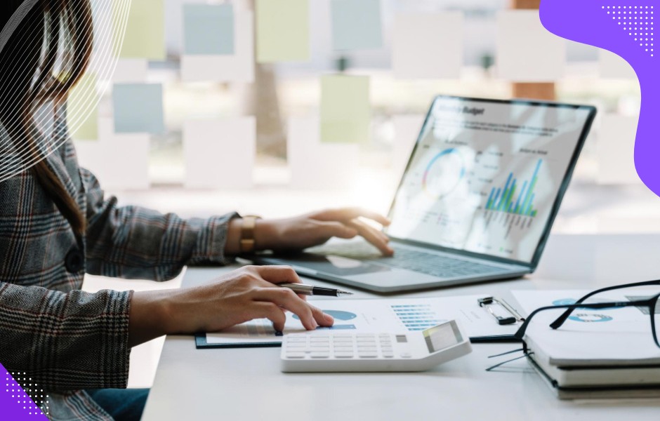 Retail analysts high-fiving after uncovering new sales insights visualizing customer data in a customized retail application.