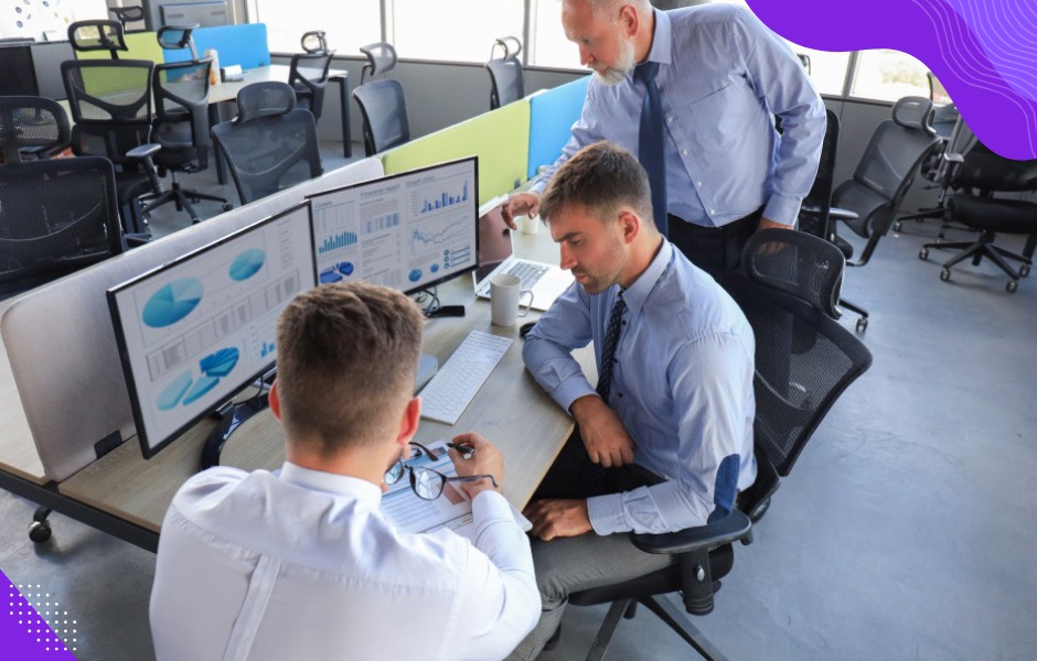 Technology leaders brainstorming how to consolidate legacy systems into a single dashboard application.