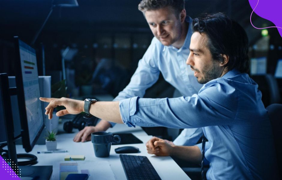 Project manager and client discussing metrics and how carefully tracking benefits proves refactoring improves code quality.