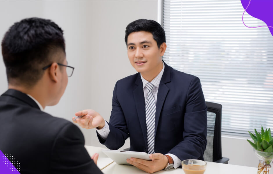 A client seeking software solutions start a discussion with Cambria software development company about outsourced projects.
