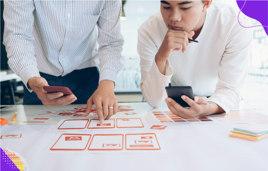 A project manager and a developer collaborating to build a custom mobile app that provides expected value for the client.