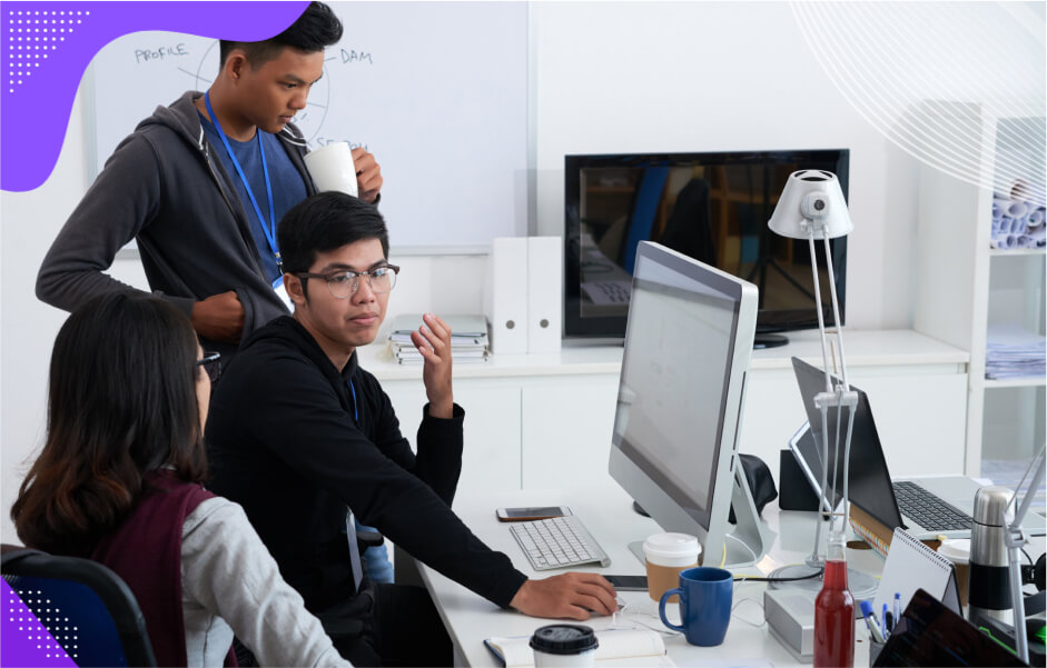 A group of developers using JavaScript to build versatile web and mobile apps with interactive features.