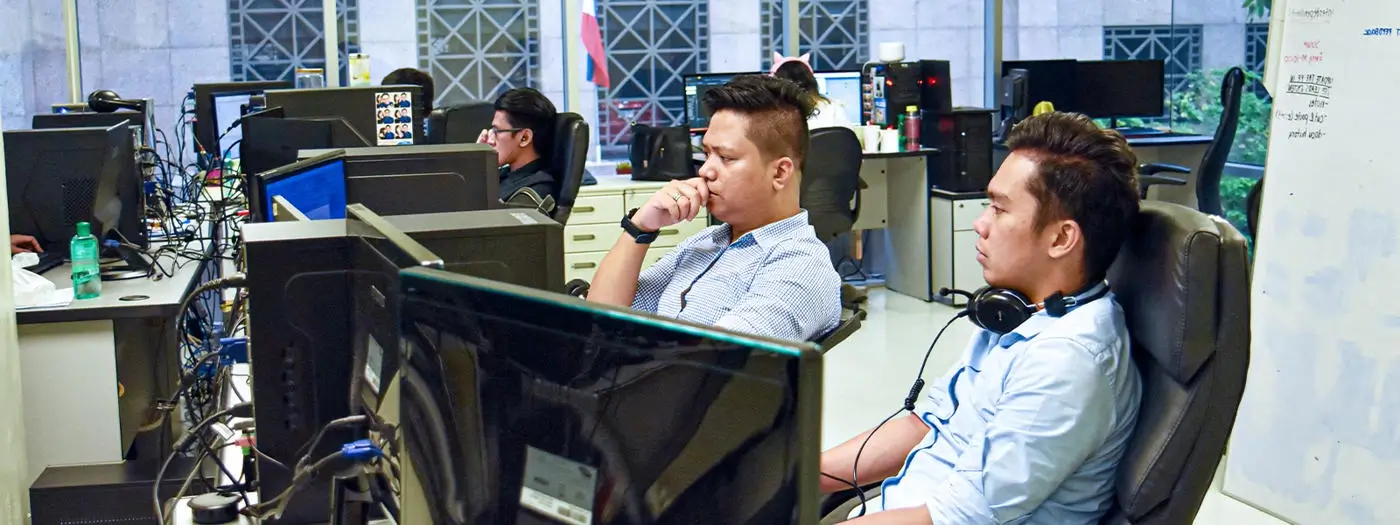 A software developer reviewing SQL Server management through database experts handling infrastructure as managed services.