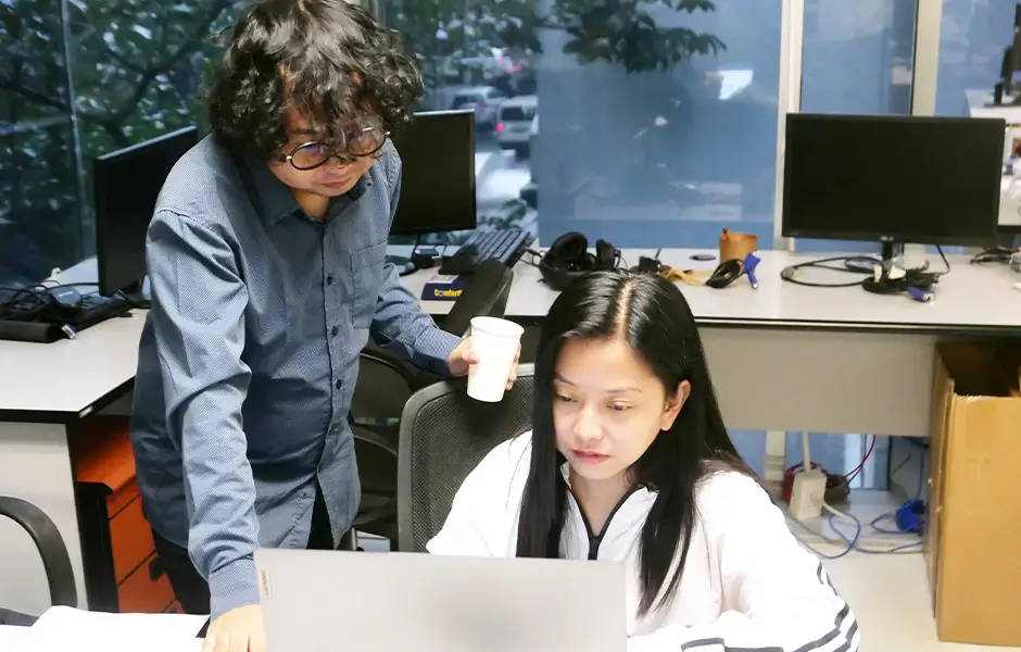 An access programmer presents a customized database solution for a client's unique workflows and software needs.